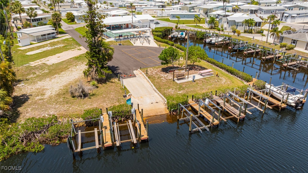 20791 Garden Drive Estero, FL 33928 - Photo 11 of 12 a view of a chairs and table on the wooden floor