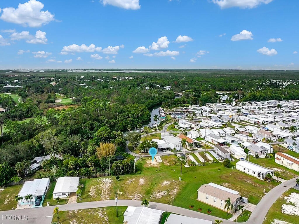 20791 Garden Drive Estero, FL 33928 - Photo 2 of 12 a view of a city with an ocean