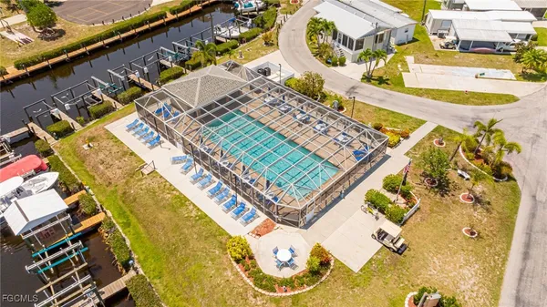 an aerial view of a house with a swimming pool