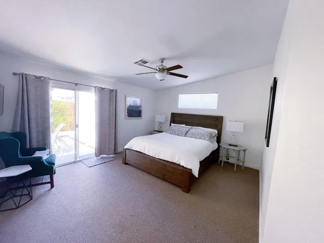 a bedroom with a bed and a couch