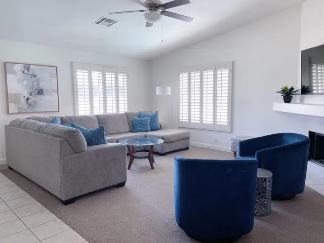 a living room with furniture and a window