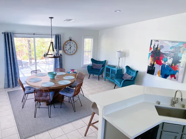 a view of a dining room with furniture window and outdoor view