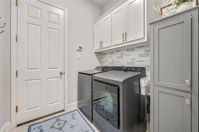 a utility room with washer and dryer
