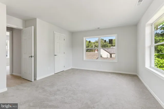 an empty room with windows