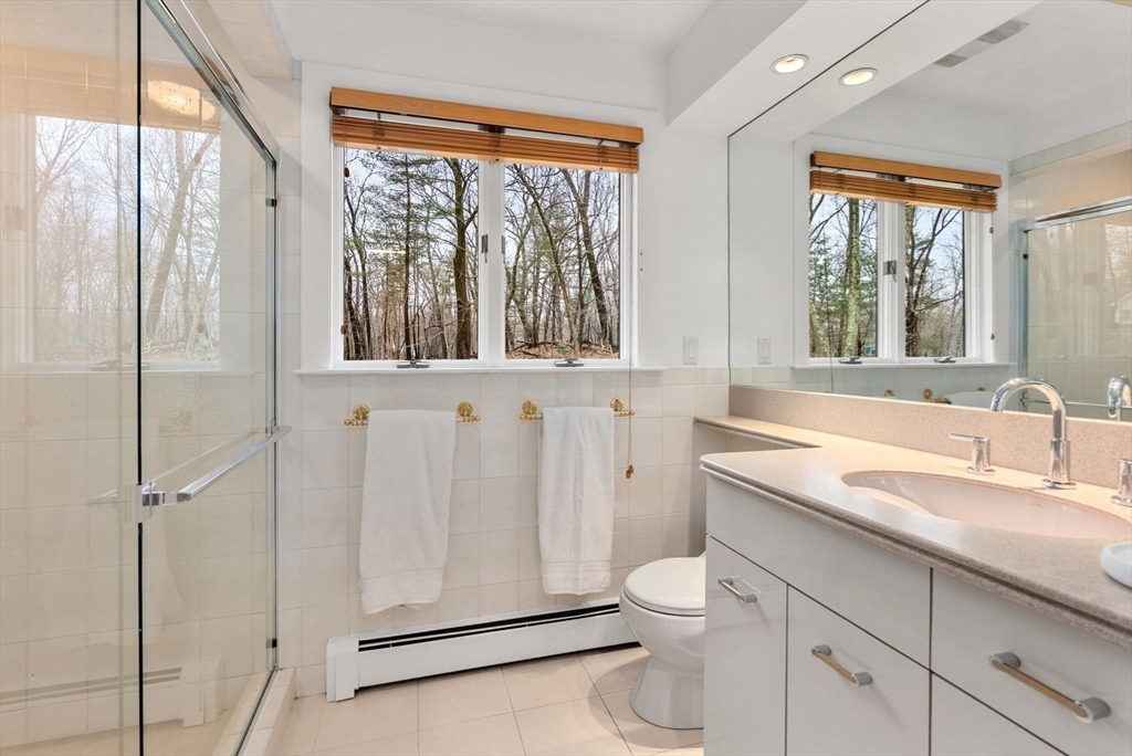 21 Gail Road Weston, MA 02493 - Photo 11 of 19 a bathroom with a granite countertop sink toilet and shower