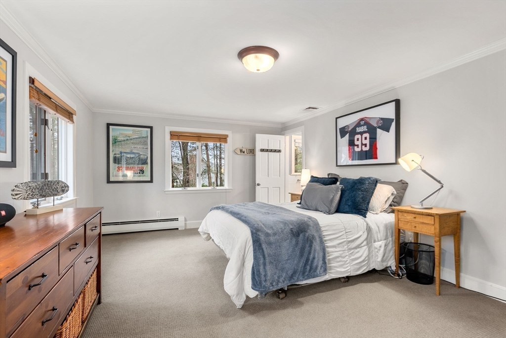 21 Gail Road Weston, MA 02493 - Photo 12 of 19 a spacious bedroom with a bed and a dresser