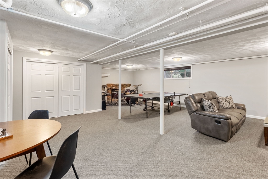 21 Gail Road Weston, MA 02493 - Photo 17 of 19 a view of a livingroom with furniture and a table