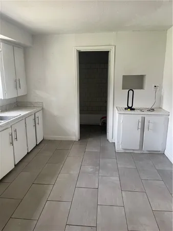 a kitchen with a cabinets and a sink
