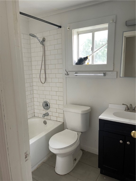 307 West 3rd Street Alice, TX 78332 - Photo 7 of 7 a bathroom with a toilet a sink a mirror and a window