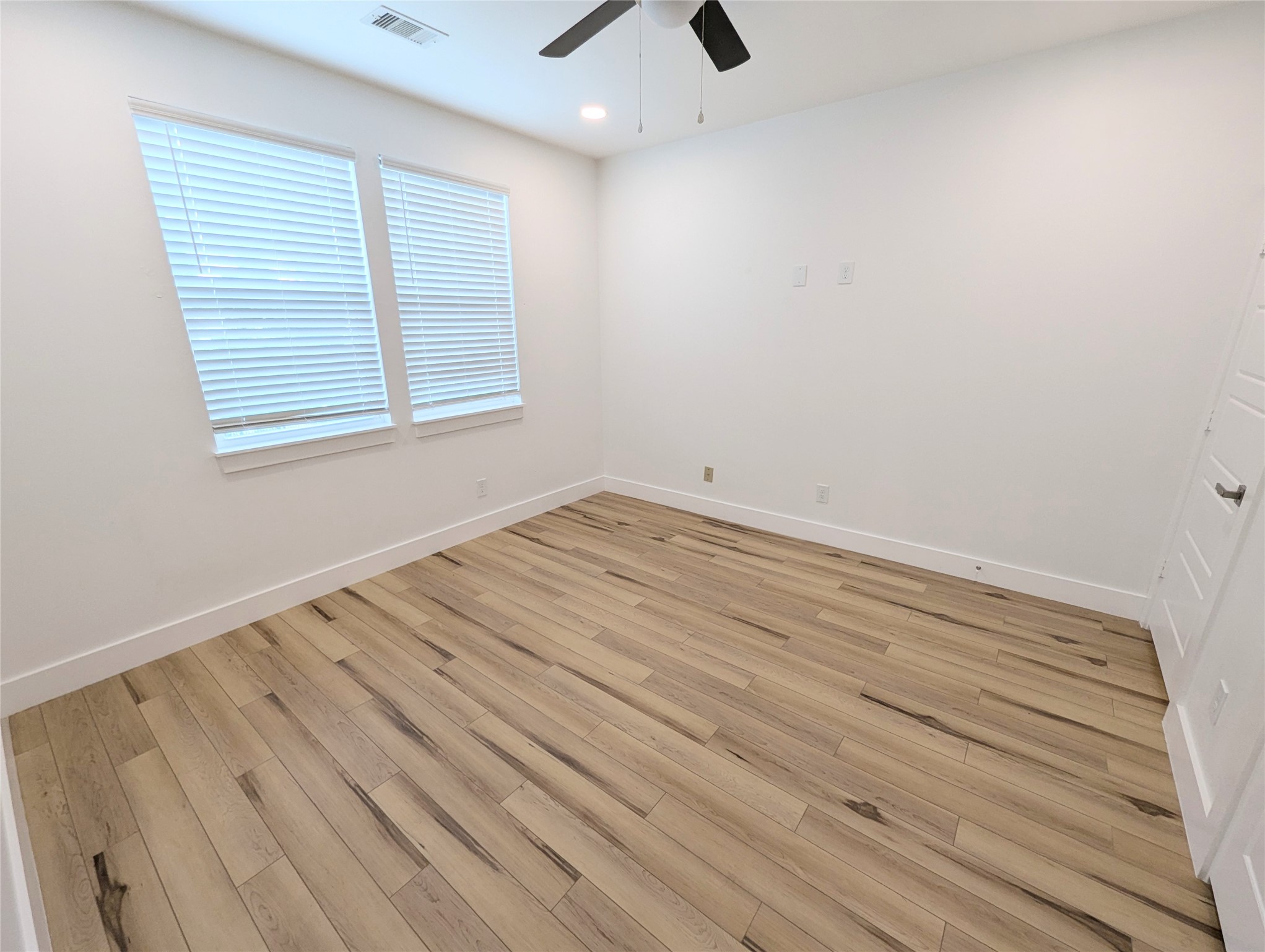 4913 Fisk Street Houston, TX 77009 - Photo 25 of 27 wooden floor in an empty room with a window