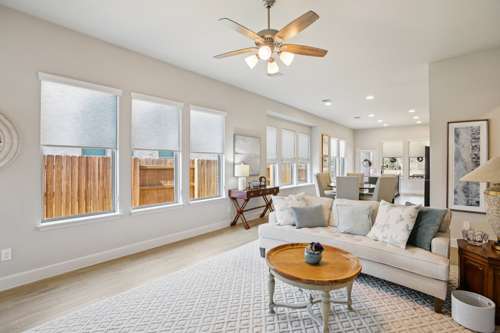 149 Plumbago Loop Bastrop, TX 78602 - Photo 12 of 33 Living area with wood finished floors, a ceiling fan, and recessed lighting