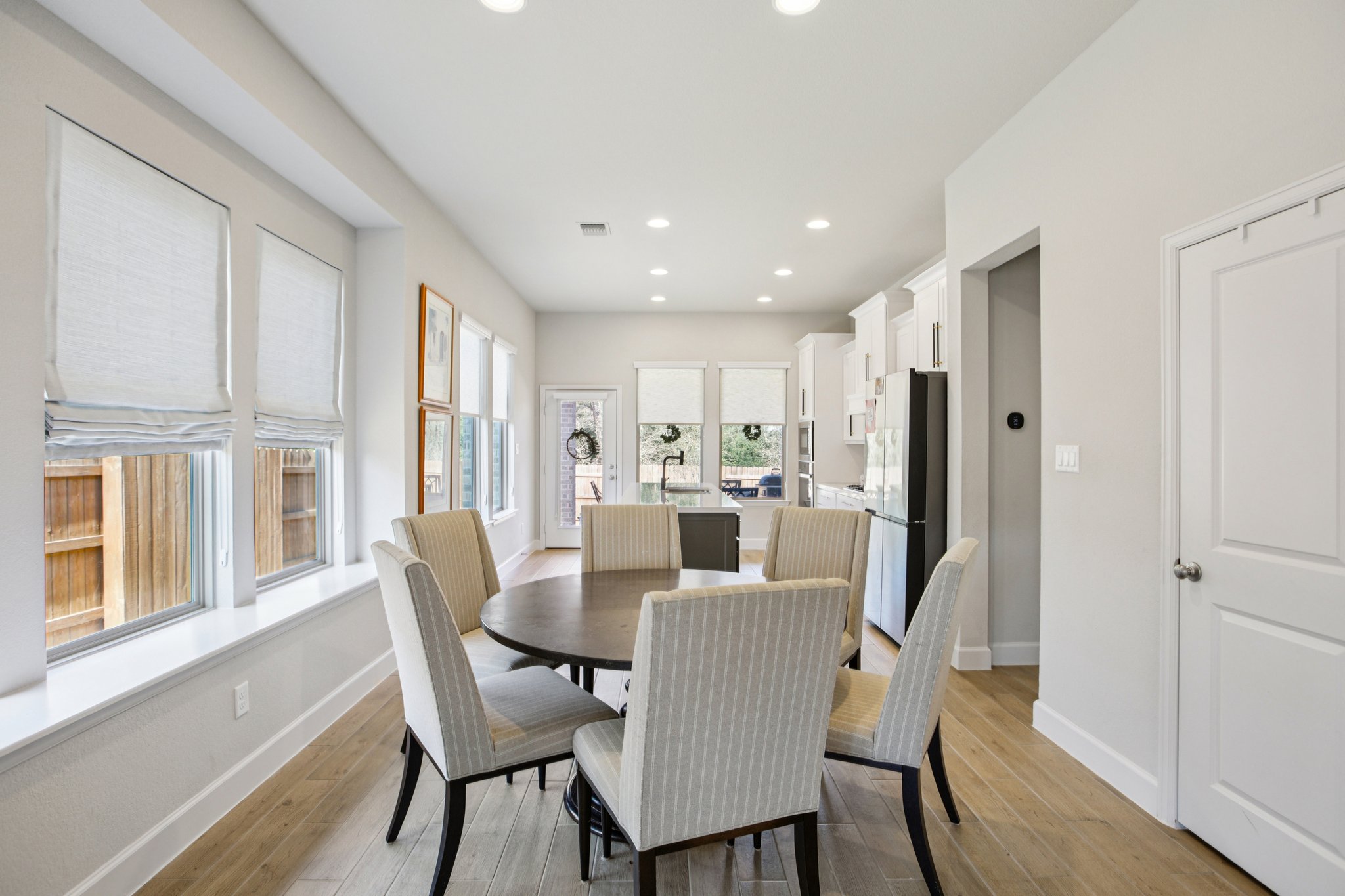 149 Plumbago Loop Bastrop, TX 78602 - Photo 13 of 33 Dining area with light wood finished floors and recessed lighting