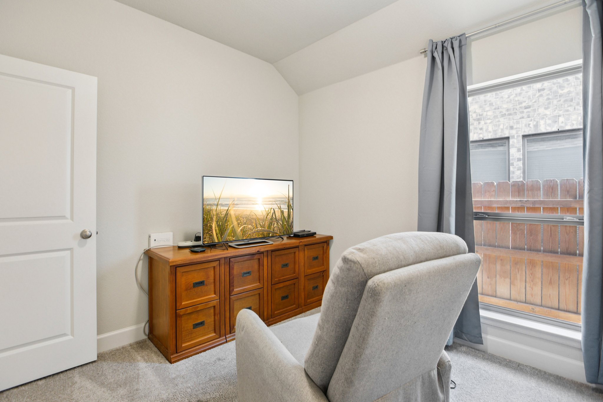 149 Plumbago Loop Bastrop, TX 78602 - Photo 21 of 33 Office space with vaulted ceiling and light carpet