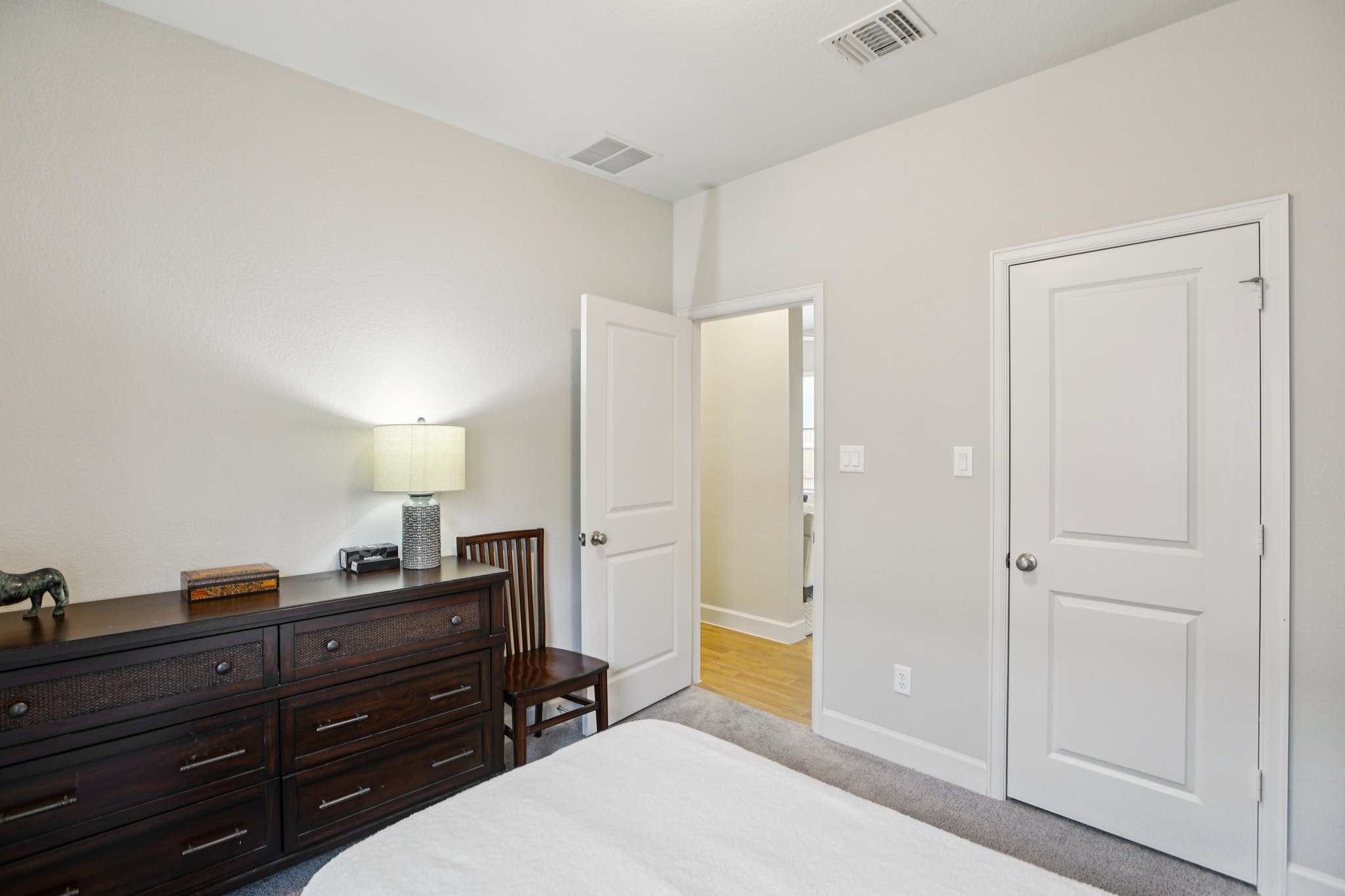149 Plumbago Loop Bastrop, TX 78602 - Photo 24 of 33 Bedroom featuring light colored carpet and baseboards