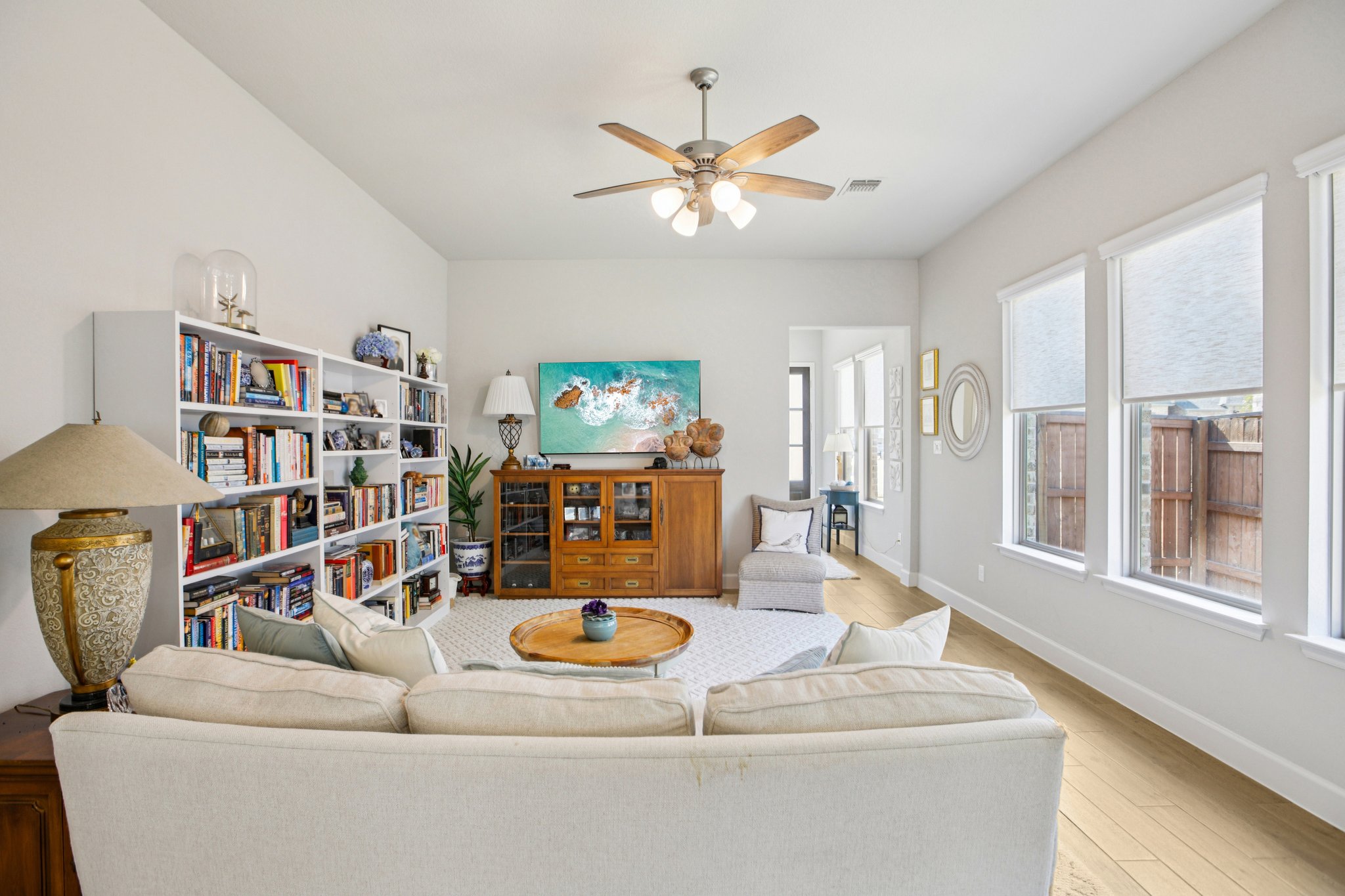 149 Plumbago Loop Bastrop, TX 78602 - Photo 9 of 33 Living room with hardwood / wood-style flooring and ceiling fan