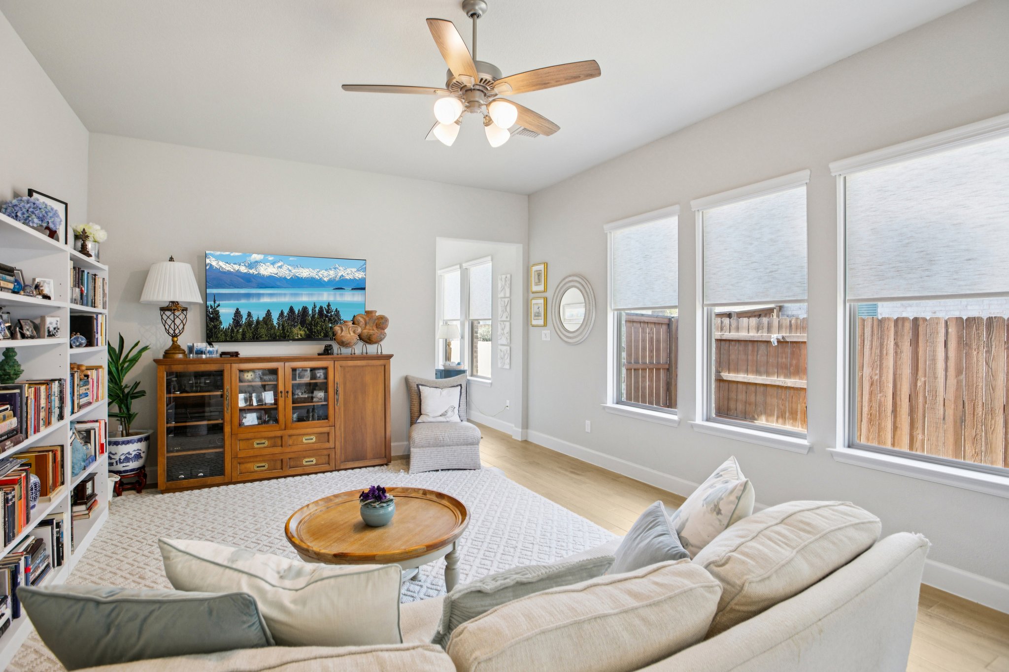 149 Plumbago Loop Bastrop, TX 78602 - Photo 10 of 33 Living room with ceiling fan and light wood-type flooring