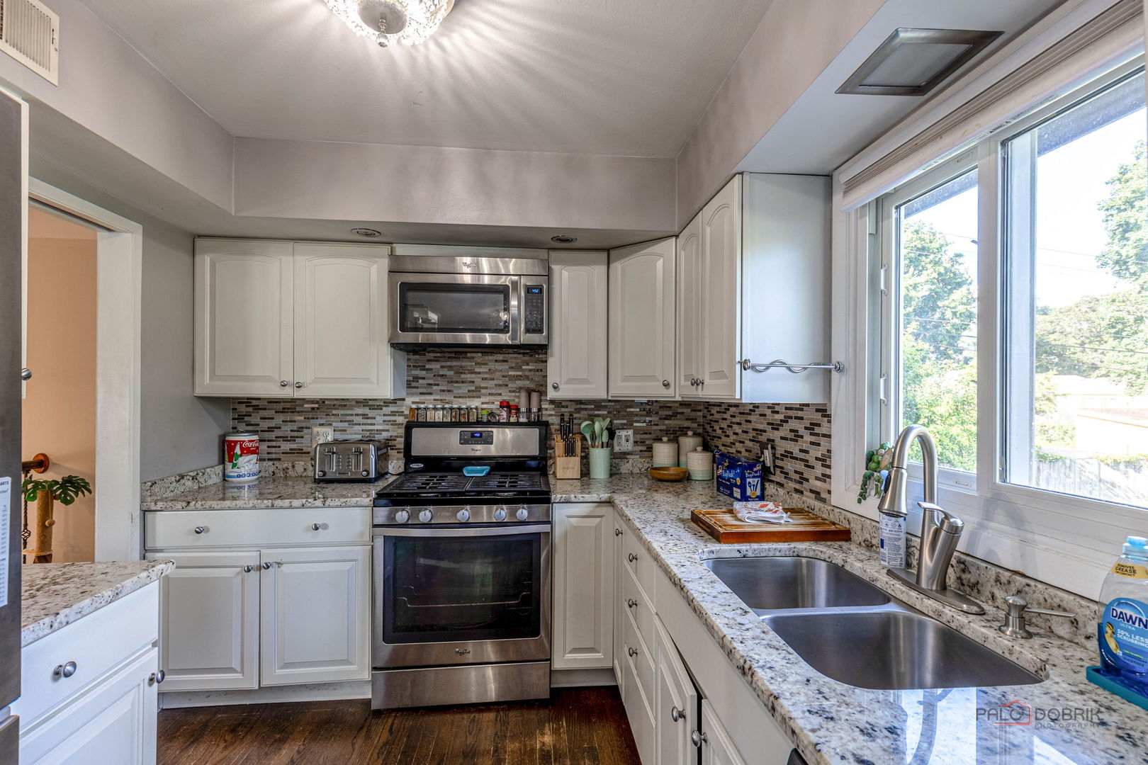 571 Nash Road Crystal Lake, IL 60014 - Photo 13 of 29 a kitchen that has a sink and a stove