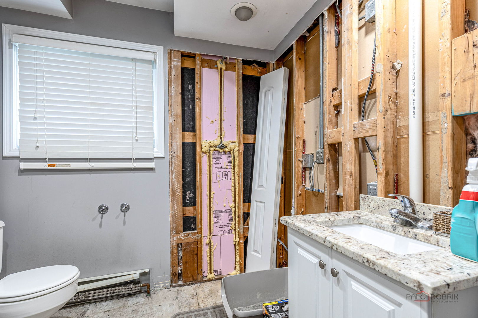 571 Nash Road Crystal Lake, IL 60014 - Photo 17 of 29 a bathroom with a granite countertop sink and a mirror