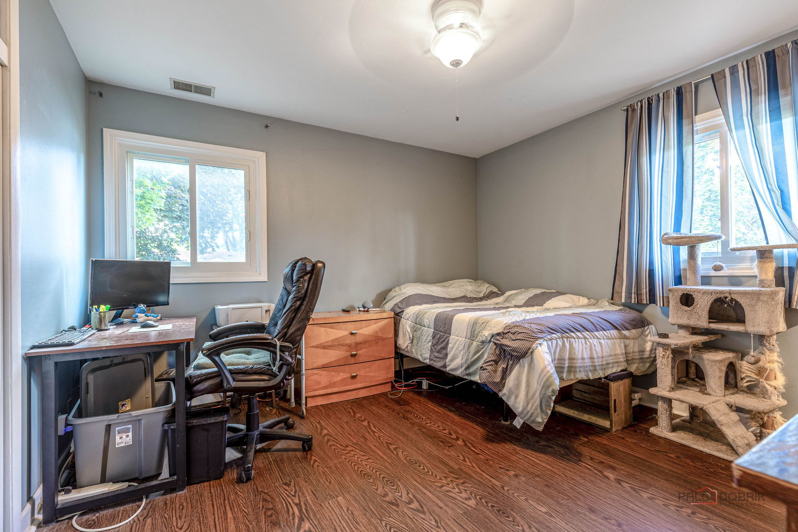 571 Nash Road Crystal Lake, IL 60014 - Photo 18 of 29 a bedroom with a bed a desk and chair with wooden floor