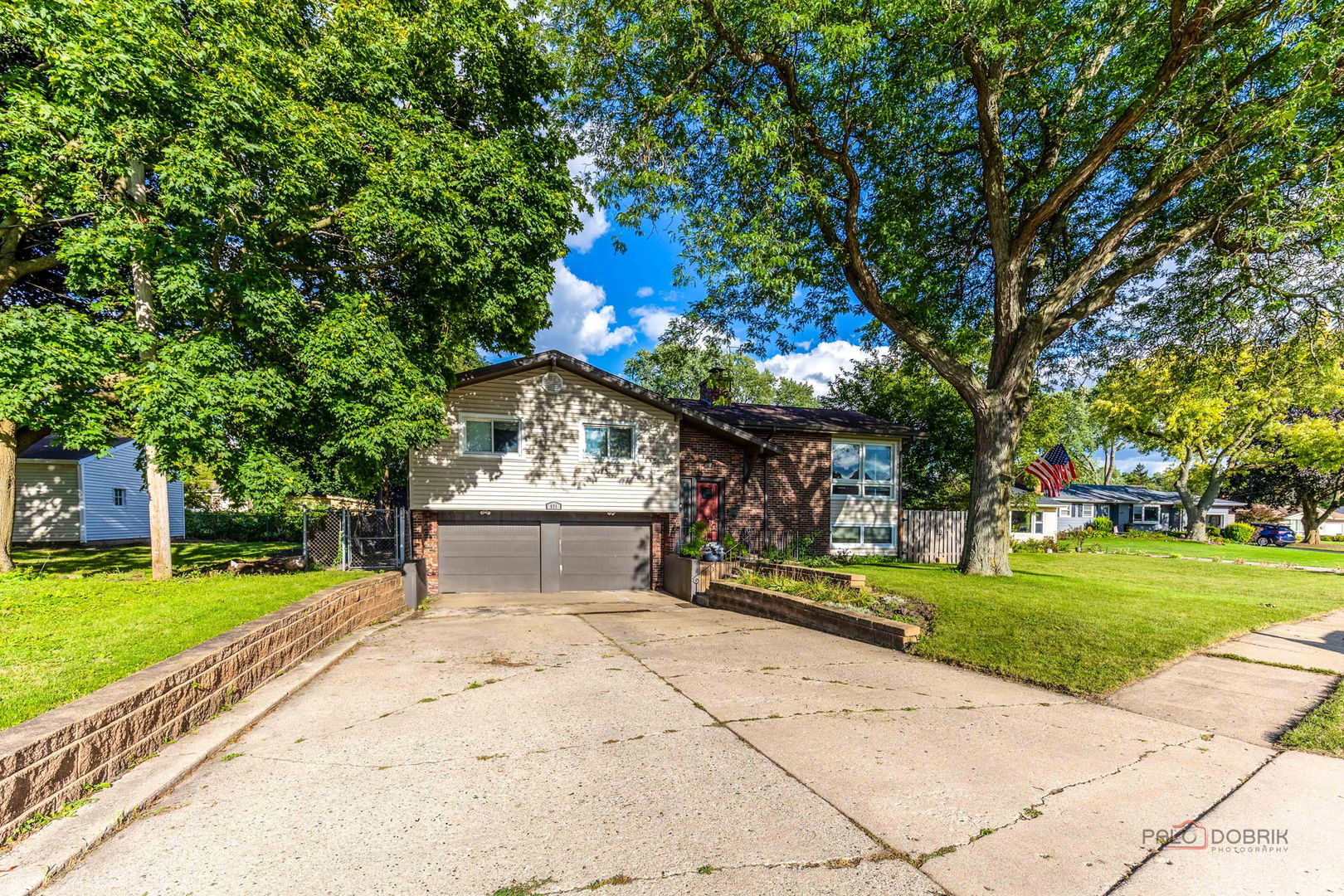 571 Nash Road Crystal Lake, IL 60014 - Photo 2 of 29 a front view of a house with a yard and trees
