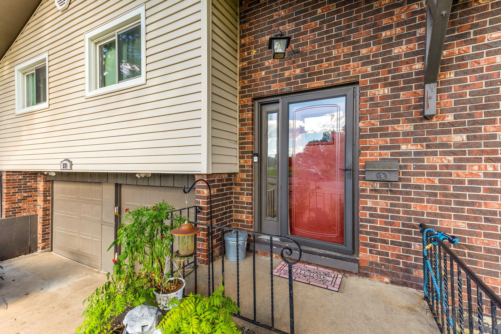 571 Nash Road Crystal Lake, IL 60014 - Photo 4 of 29 a front view of a house with a garage