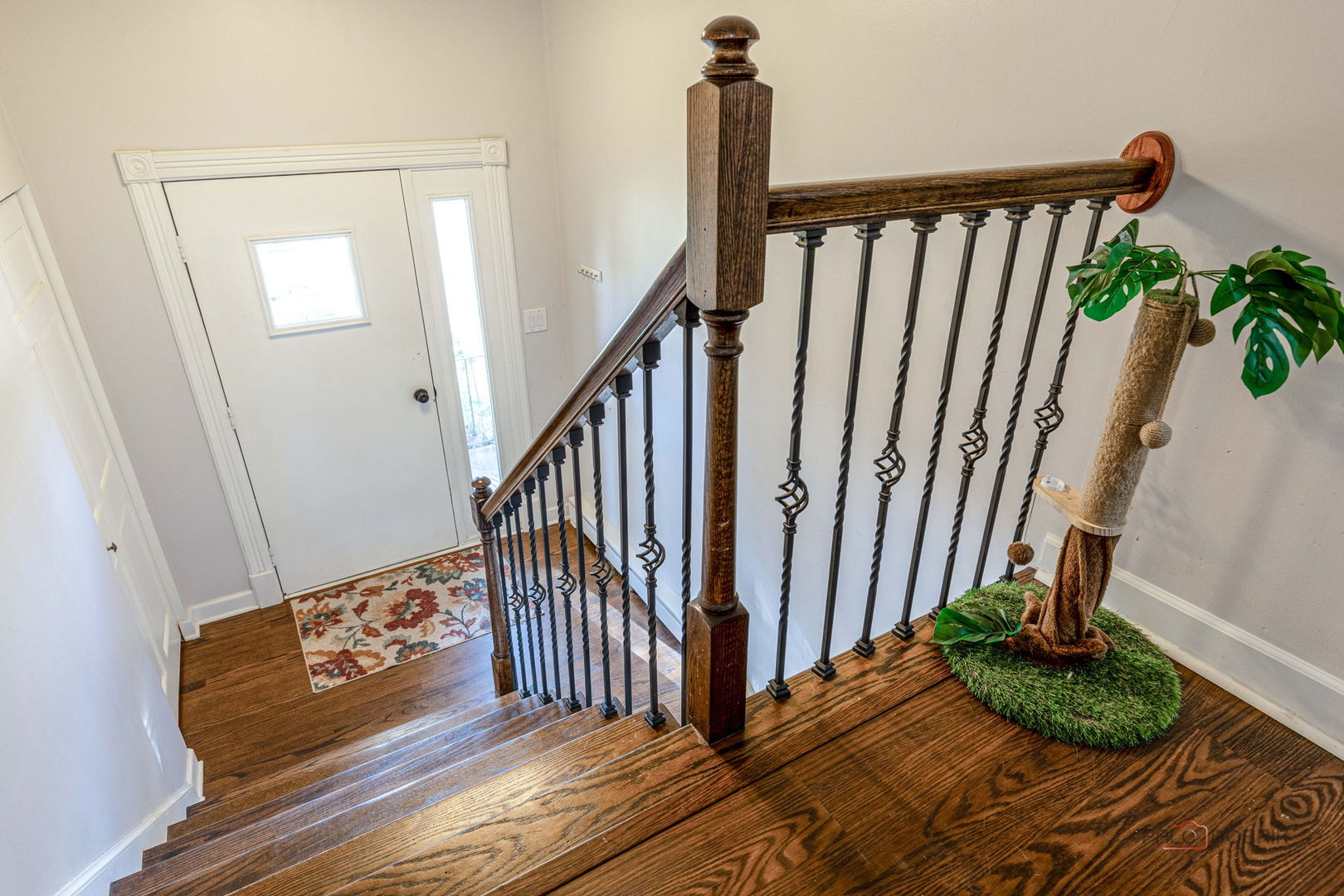 571 Nash Road Crystal Lake, IL 60014 - Photo 6 of 29 a view of a hallway with wooden floor and stairs