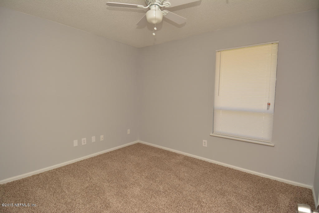3156 Ricky Drive Jacksonville, FL 32223 - Photo 6 of 9 an empty room with a window