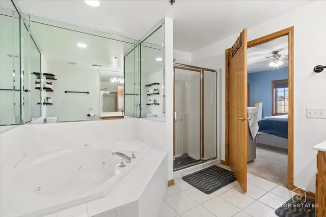 a bathroom with a bathtub and a shower