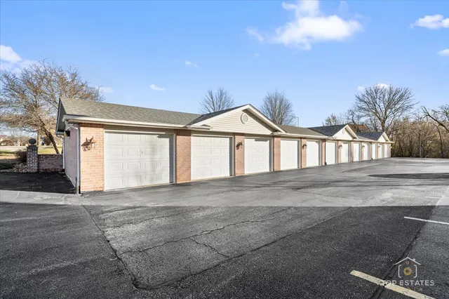 a view of a house with a yard and garage