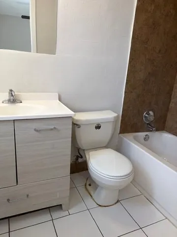 a bathroom with a sink toilet and bathtub