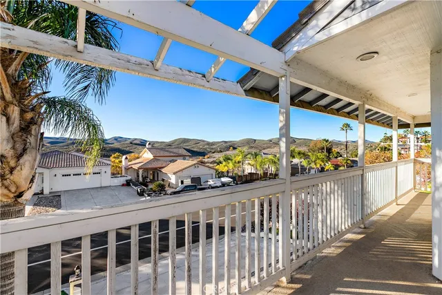 a view of a balcony with potted plants