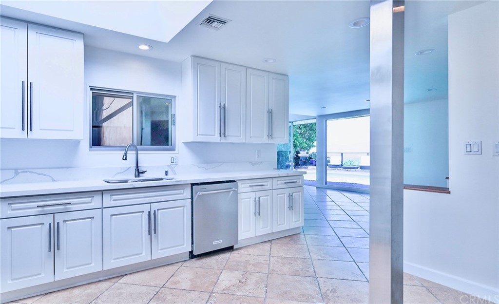 13425 Java Drive Beverly Hills, CA 90210 - Photo 11 of 34 a kitchen with a sink and cabinets