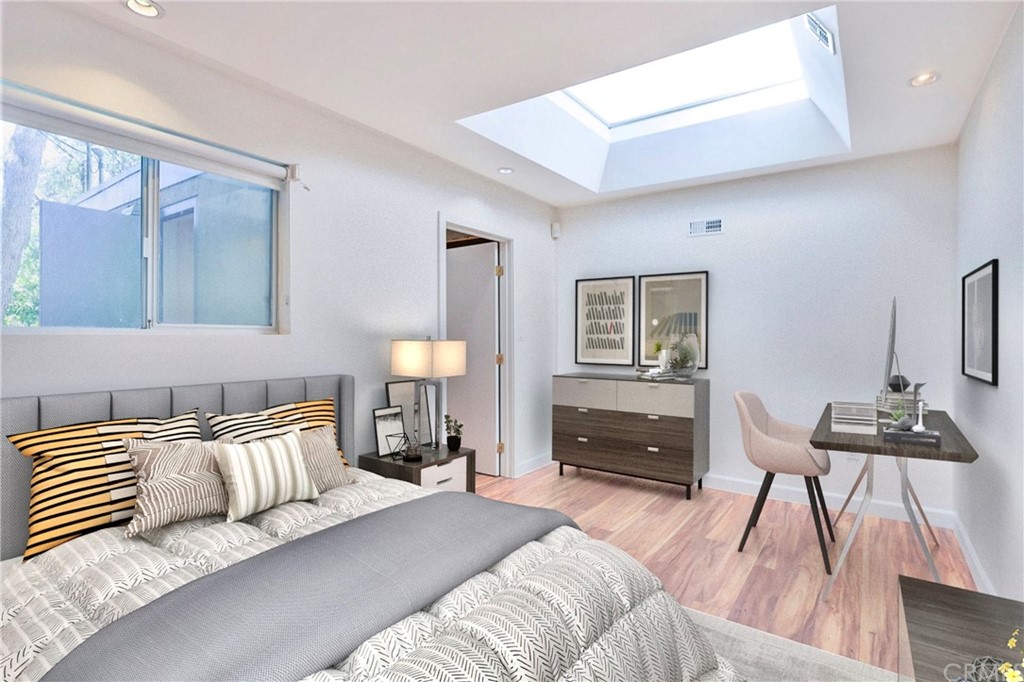 13425 Java Drive Beverly Hills, CA 90210 - Photo 13 of 34 a bedroom with a bed and wooden floor