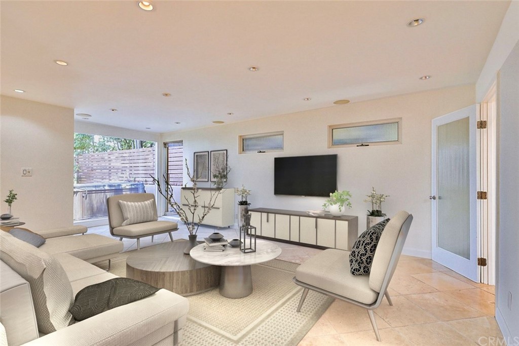 13425 Java Drive Beverly Hills, CA 90210 - Photo 14 of 34 a living room with furniture a flat screen tv and a large window