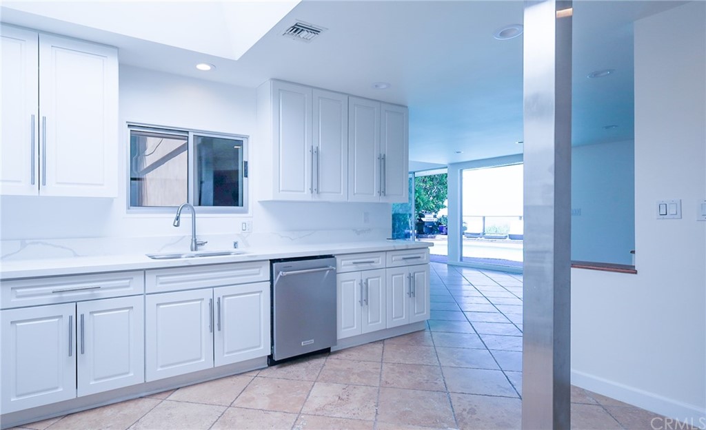 13425 Java Drive Beverly Hills, CA 90210 - Photo 8 of 34 a kitchen with a sink and cabinets