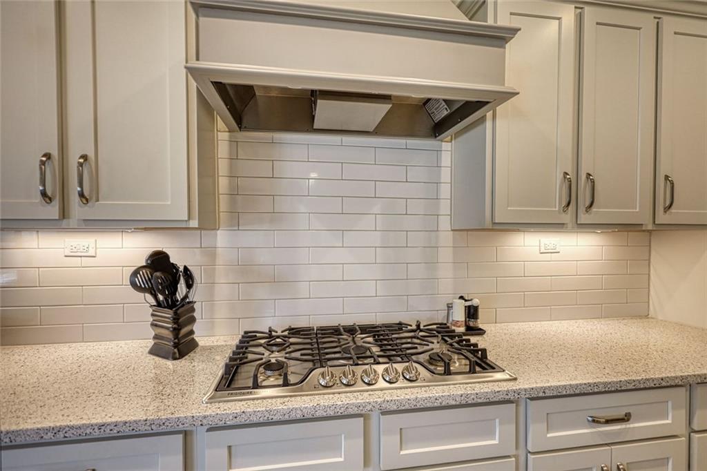 612 Haven Way Monroe, GA 30655 - Photo 16 of 44 a kitchen with white cabinets and appliances