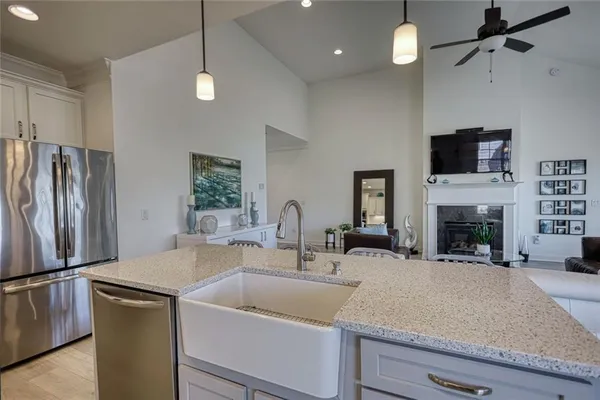 a kitchen with a sink and a refrigerator