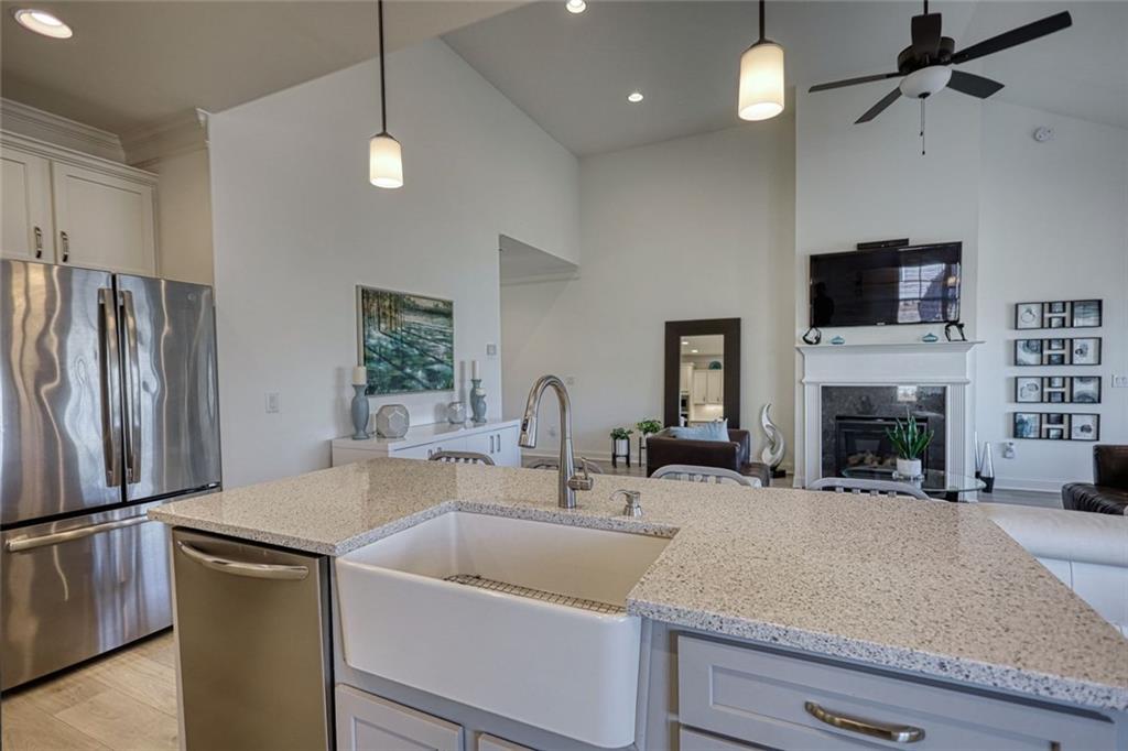 612 Haven Way Monroe, GA 30655 - Photo 17 of 44 a kitchen with a sink and a refrigerator