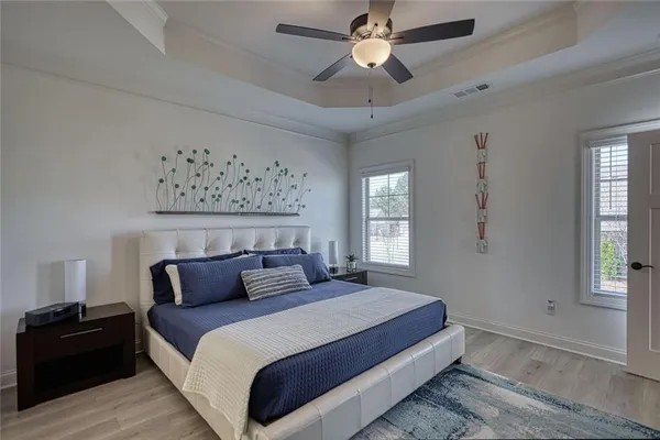 a bedroom with bed and window