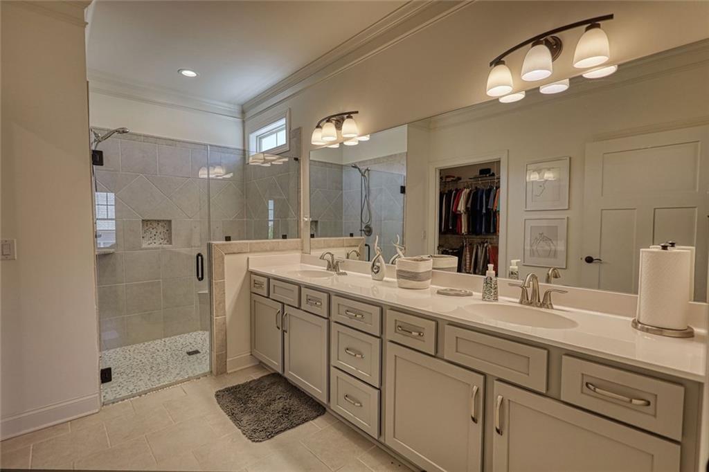 612 Haven Way Monroe, GA 30655 - Photo 28 of 44 a bathroom with double sink and a mirror