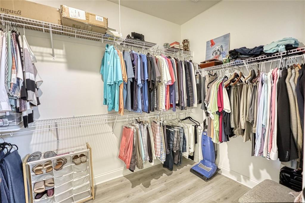 612 Haven Way Monroe, GA 30655 - Photo 31 of 44 a view of walk in closet with clothes