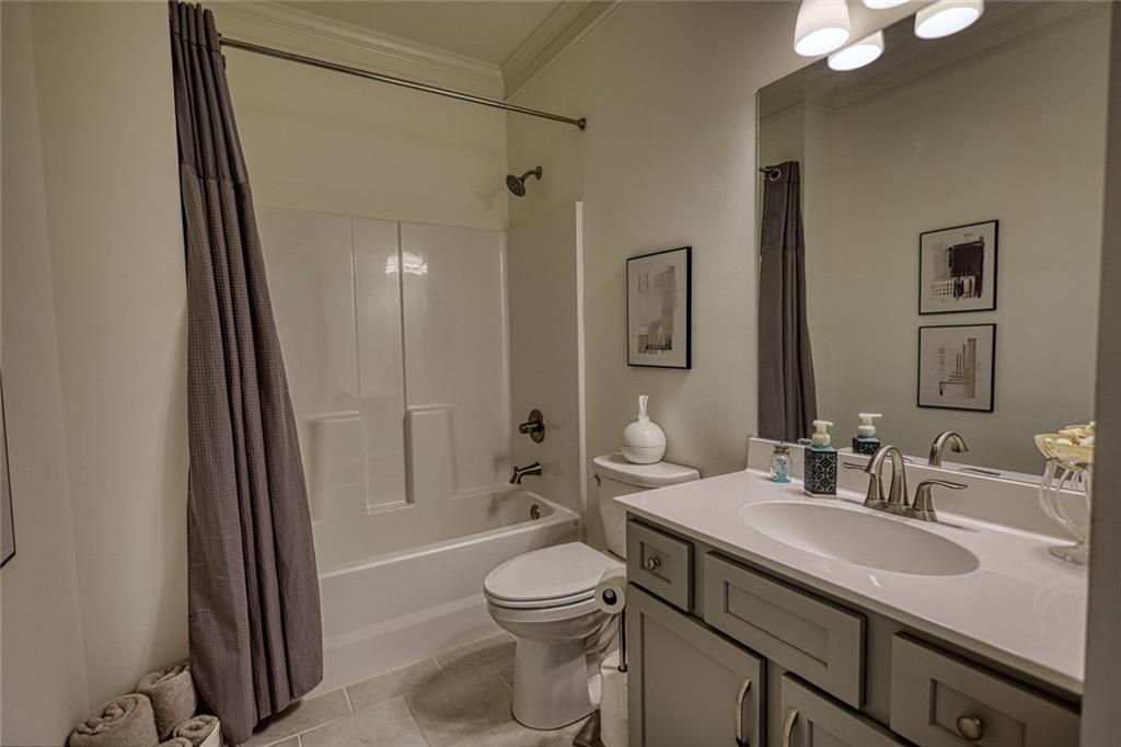 612 Haven Way Monroe, GA 30655 - Photo 34 of 44 a bathroom with a sink a toilet and shower