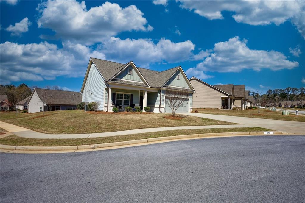 612 Haven Way Monroe, GA 30655 - Photo 4 of 44 a view of the house with a big yard and large trees