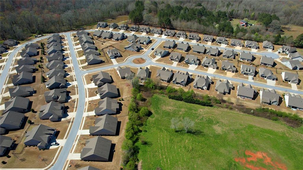 612 Haven Way Monroe, GA 30655 - Photo 42 of 44 a view of a garden with a building