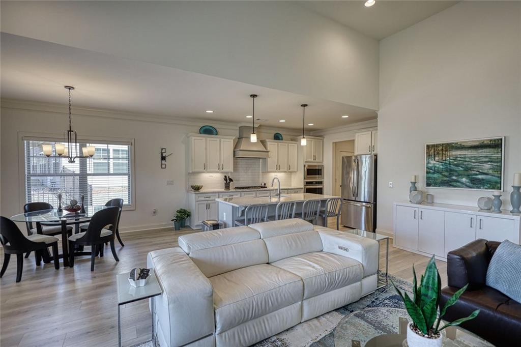 612 Haven Way Monroe, GA 30655 - Photo 10 of 44 a living room with furniture and a large window