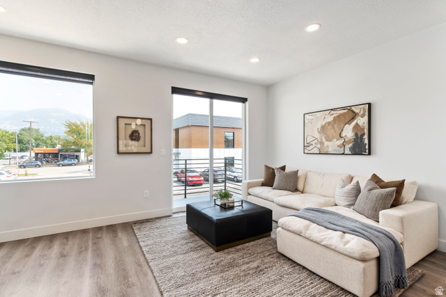 32 West 400 South Bountiful, UT 84010 - Photo 5 of 31 Living area featuring wood finished floors, recessed lighting, and a textured ceiling. Model Home