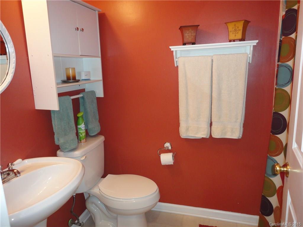 952 Pleasant Ridge Road, Unit 31 Fort Mill, SC 29715 - Photo 13 of 23 a bathroom with a toilet a sink and mirror