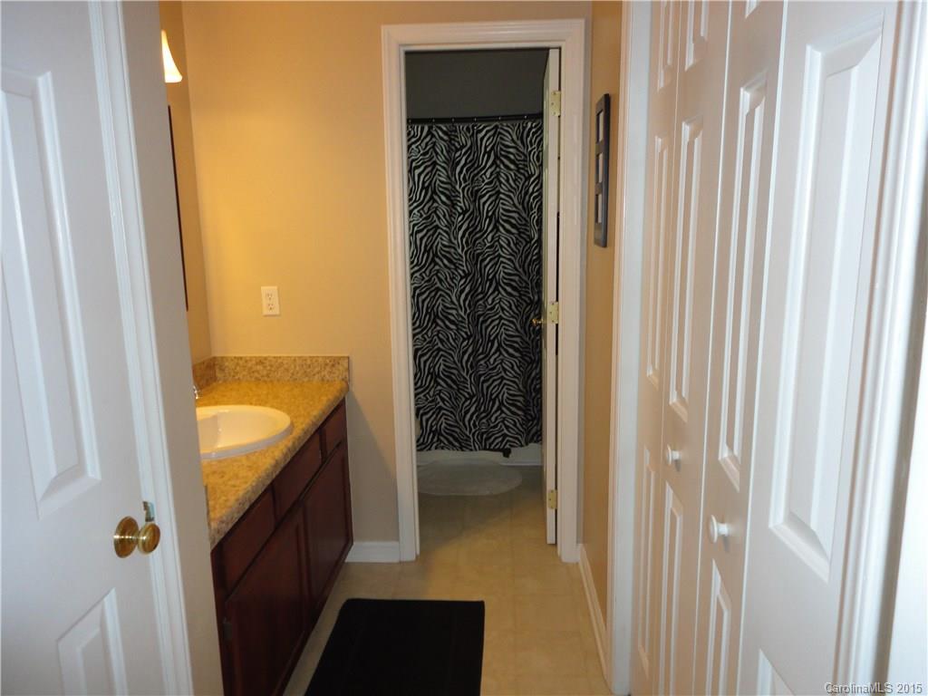 952 Pleasant Ridge Road, Unit 31 Fort Mill, SC 29715 - Photo 17 of 23 a bathroom with a granite countertop sink and a mirror