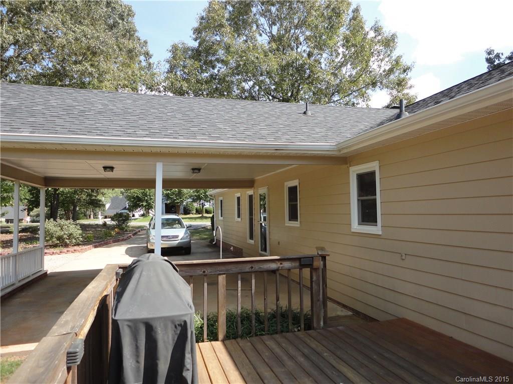 952 Pleasant Ridge Road, Unit 31 Fort Mill, SC 29715 - Photo 19 of 23 a view of a patio with table and chairs with wooden floor and fence
