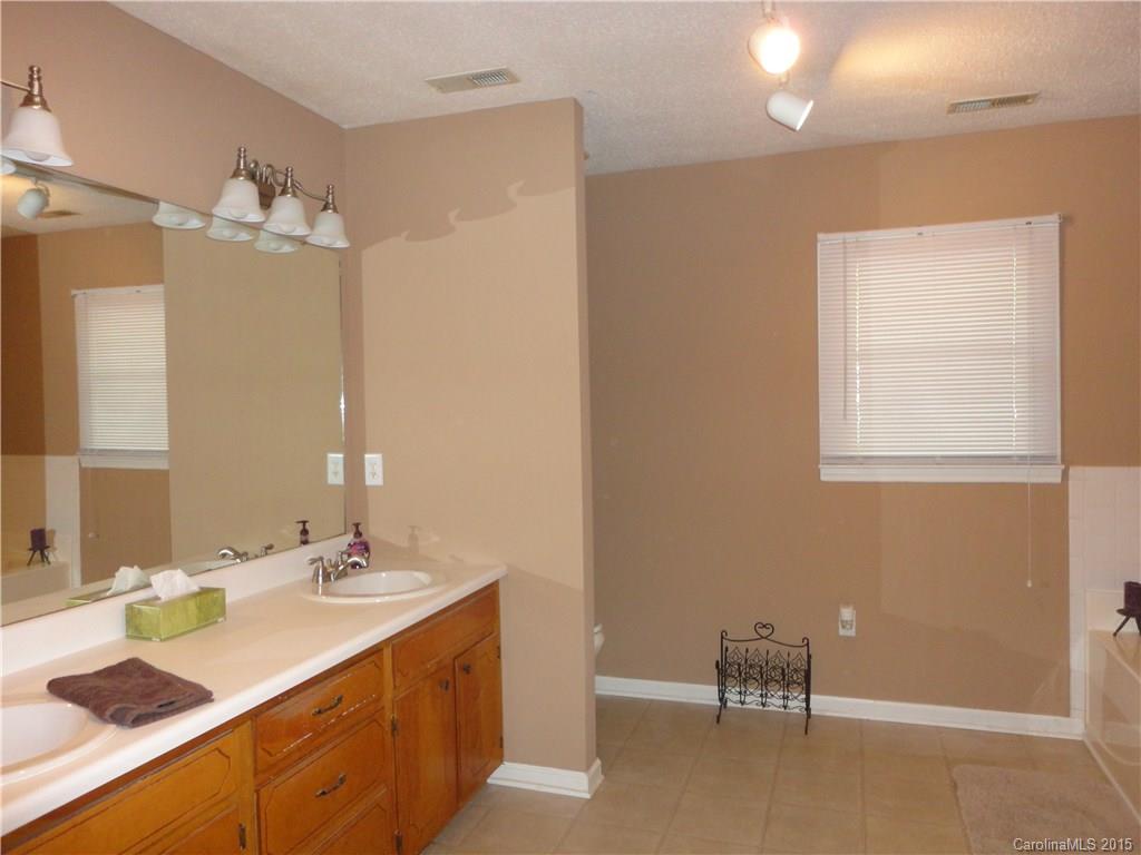 952 Pleasant Ridge Road, Unit 31 Fort Mill, SC 29715 - Photo 9 of 23 a bathroom with a double vanity sink mirror and